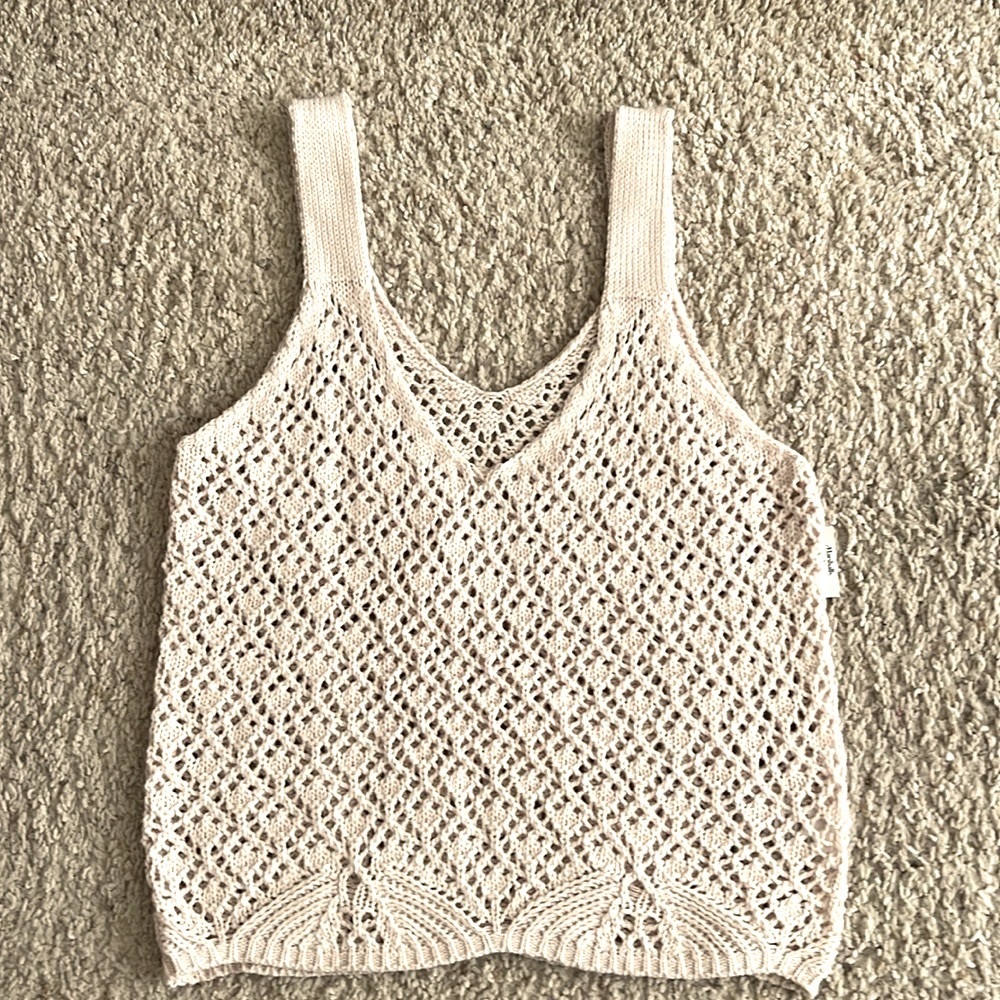 Sleeveless, cream color